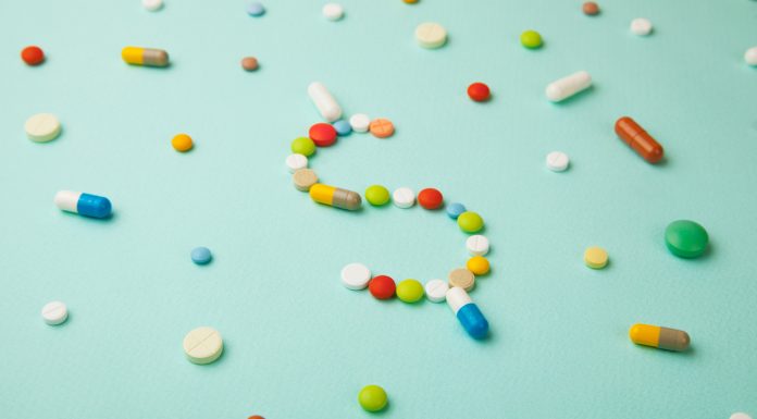 Cost savings from pharmacist-led post-discharge care pills arranged in dollar sign