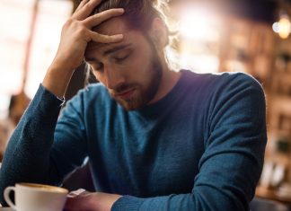 People living with chronic pain fear stigma, research finds man holding forehead