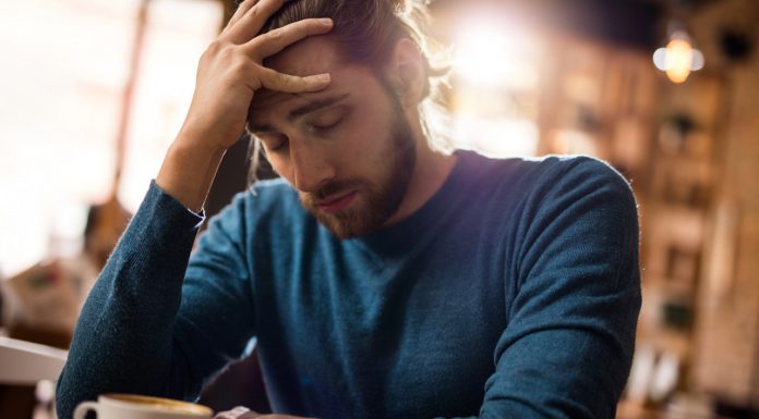 People living with chronic pain fear stigma, research finds man holding forehead