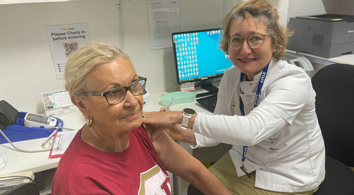 First Queensland community pharmacists join COVID-19 vaccine effort Pharmacist Sarah Parry-Okeden vaccinating a patient at Acton Health Pharmacy